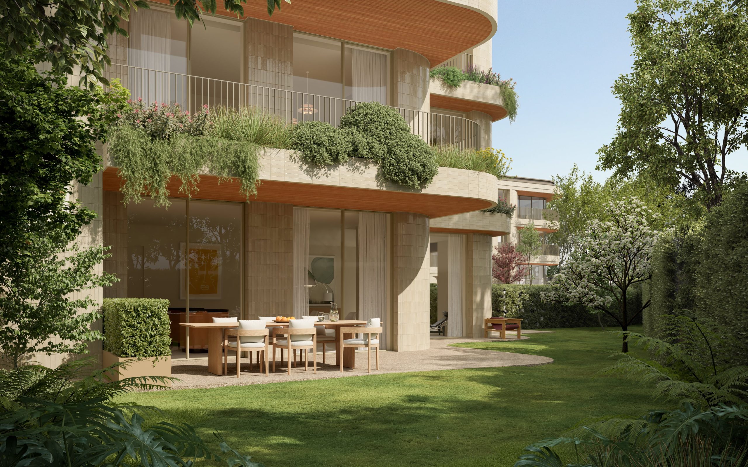 Vista do jardim e varandas verdes do empreendimento Foliage Fercopor, com área de refeição exterior e arquitetura integrada na natureza